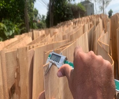 Vifuko quality control inspecting eucalyptus core veneer thickness with digital caliper in Vietnam