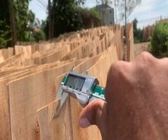 Vifuko quality control inspecting eucalyptus core veneer thickness with digital caliper in Vietnam