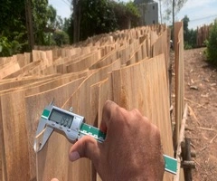 Vifuko quality control inspecting eucalyptus core veneer thickness with digital caliper in Vietnam