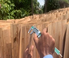 Vifuko quality control inspecting eucalyptus core veneer thickness with digital caliper in Vietnam